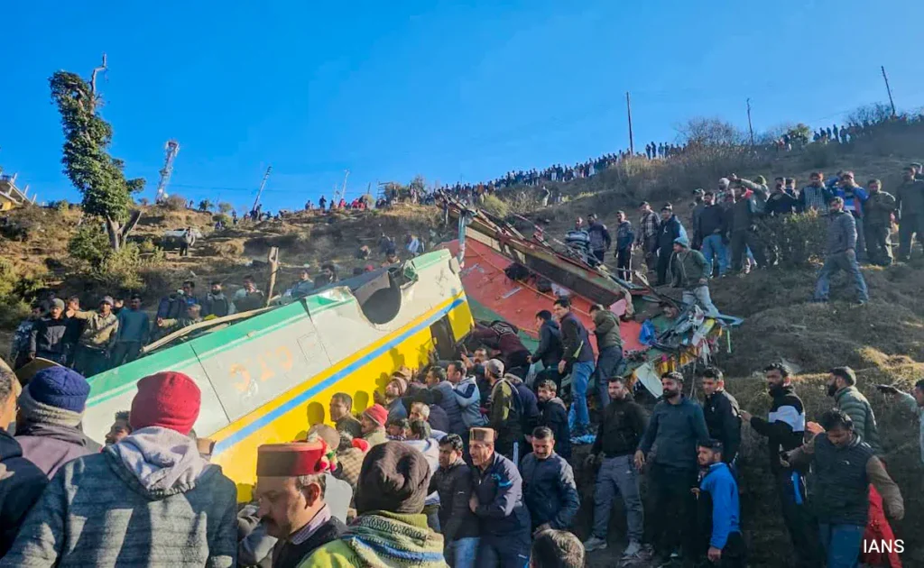 Image Alt Text: Rescue teams and local residents at the site of the private bus accident in Haripurdhar, Himachal Pradesh.
