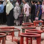 Empty LPG cylinders stacked at a gas distribution center during LPG shortage in India