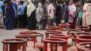 Empty LPG cylinders stacked at a gas distribution center during LPG shortage in India