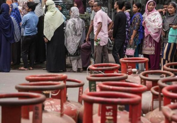 Empty LPG cylinders stacked at a gas distribution center during LPG shortage in India