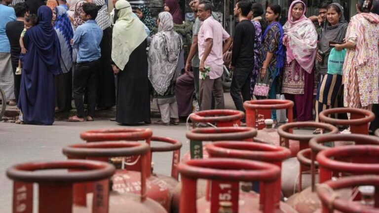 Empty LPG cylinders stacked at a gas distribution center during LPG shortage in India